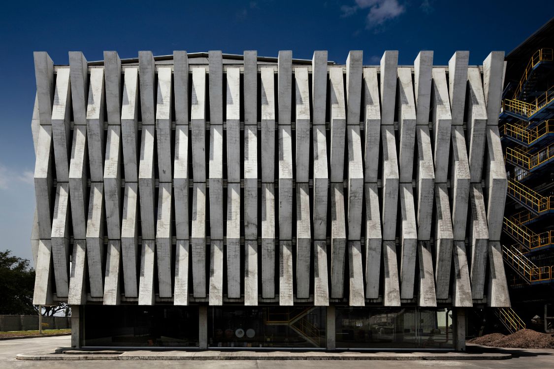 Argos Cement Plant - Full view of the building's geometric prefabricated concrete facade screen - Felipe Gonzalez Pacheco.jpg